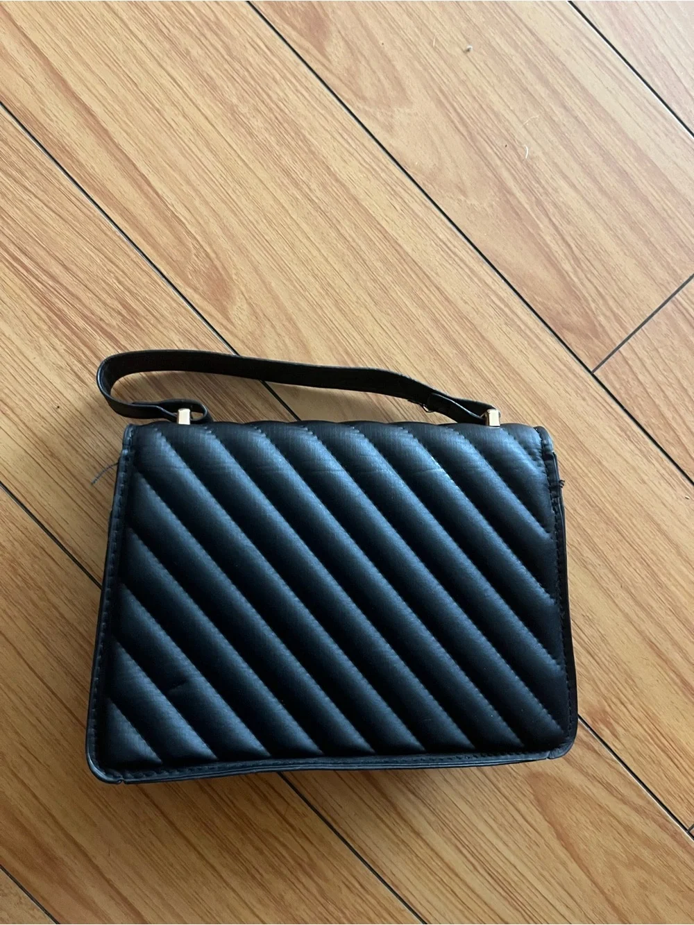 Black Quilted Shoulder Bag with Gold Heart Accent